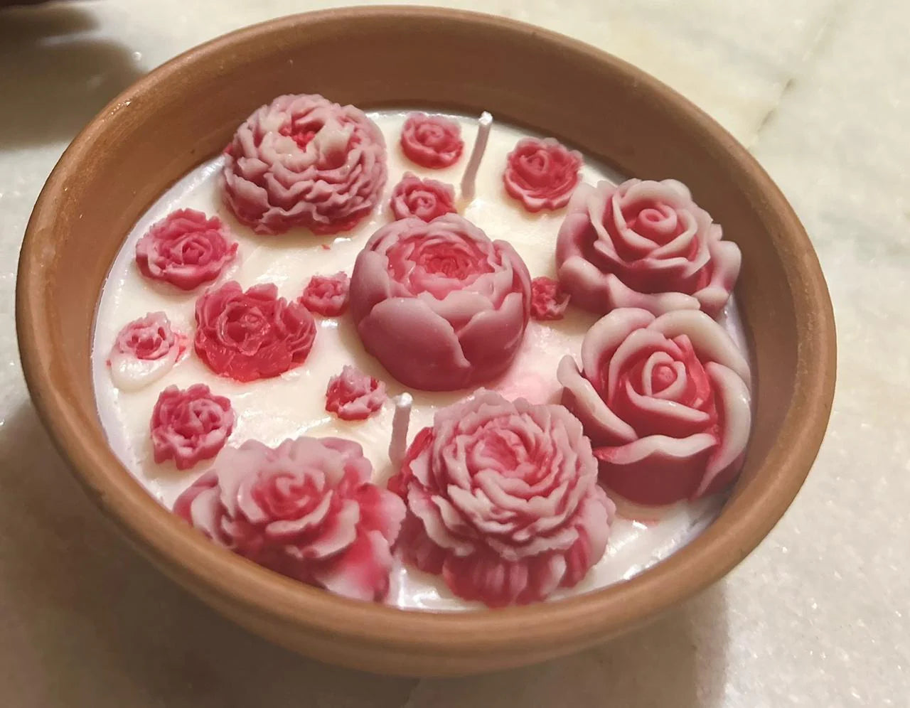Lavender soy wax terracotta candle with handcrafted floral design, eco-friendly luxury home décor.