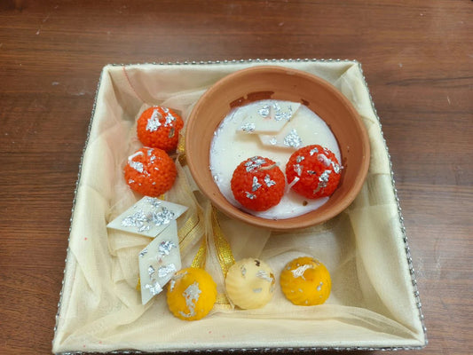 Premium Diwali Gift Hamper with Motichoor Laddoo, Kaju Katli, and festive sweets decorated with silver varkh